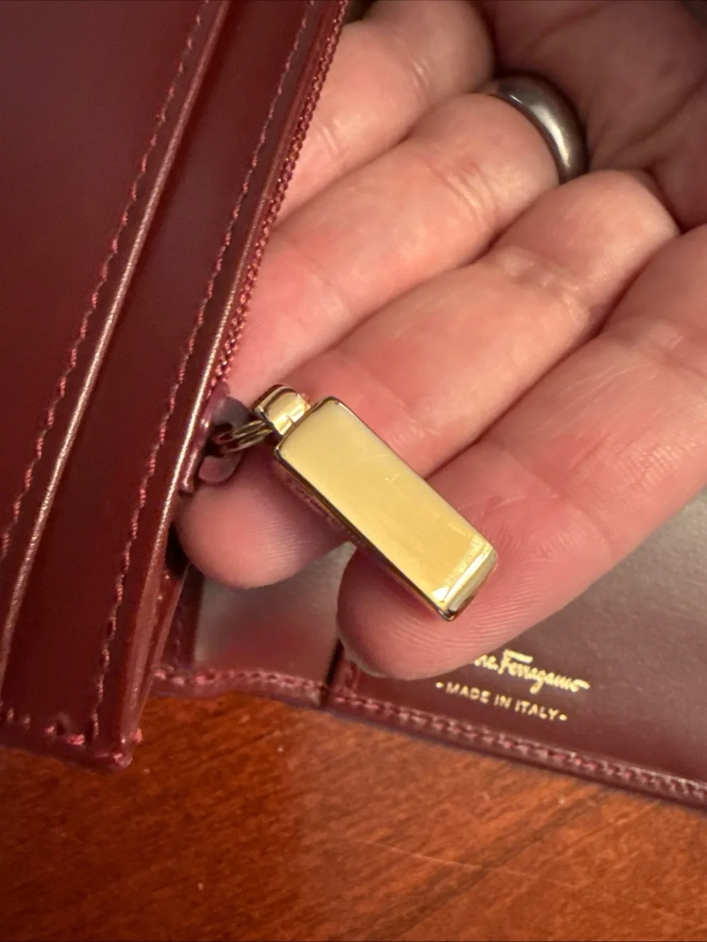 Salvatore Ferragamo Burgundy Leather Wallet with Gold Hardware